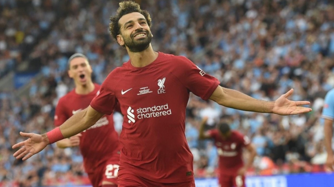 Penyerang Liverpool, Mohamed Salah merayakan gol