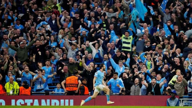 Manchester City merayakan gol